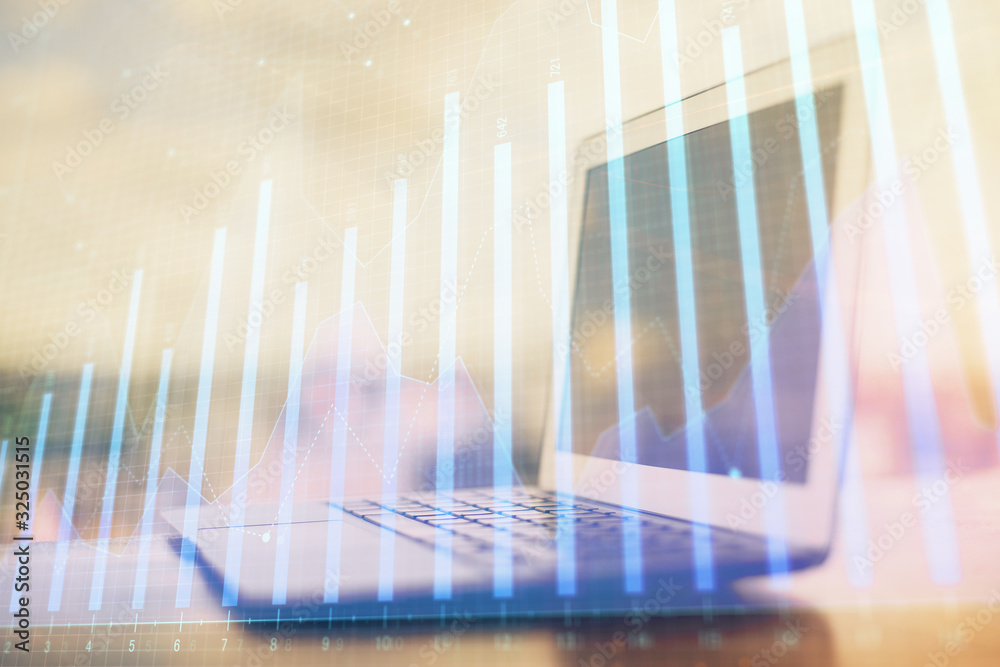 Forex Chart hologram on table with computer background. Multi exposure. Concept of financial markets. Forex Chart hologram on table with computer background. Multi exposure. Concept of financial markets.