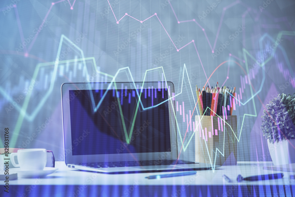 Stock market chart hologram drawn on personal computer background. Double exposure. Concept of investment. Stock market chart hologram drawn on personal computer background. Double exposure. Concept of investment.