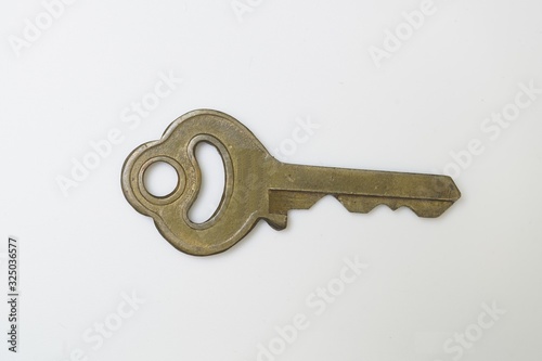 A old vintage brass key in the past. photo