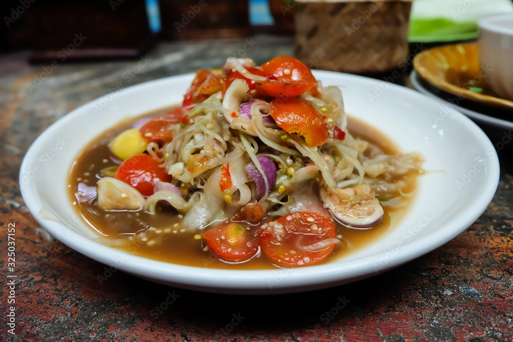 Papaya salad Luang Prabang uses a large scraped papaya line, unique to Luang Prabang, Laos. Papaya salad Luang Prabang uses a large scraped papaya line, unique to Luang Prabang, Laos.