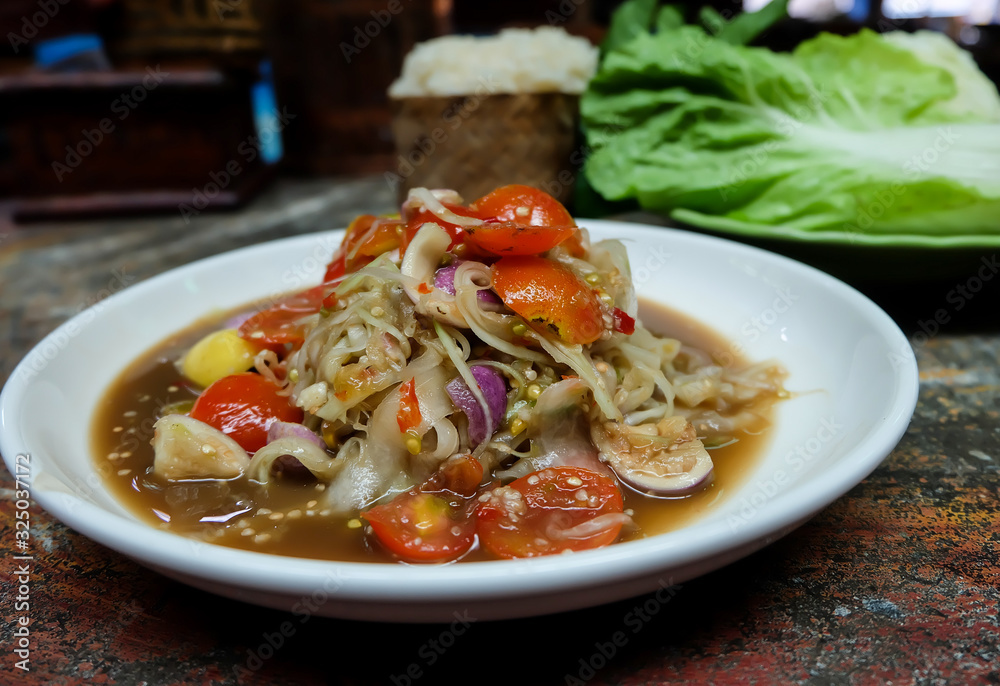 Papaya salad Luang Prabang uses a large scraped papaya line, unique to Luang Prabang, Laos. Papaya salad Luang Prabang uses a large scraped papaya line, unique to Luang Prabang, Laos.
