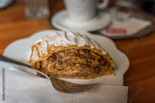 Photography Walnut apple strudel dessert on white plate