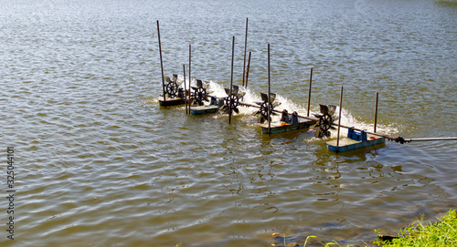 Waste water treatment system. Water turbine for oxygen filling to water. Aerator machine in the pond