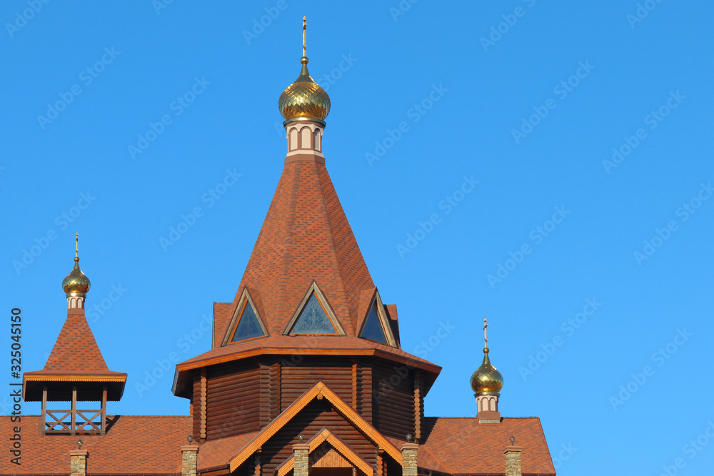 Church and cross against the blue sky Church and cross against the blue sky