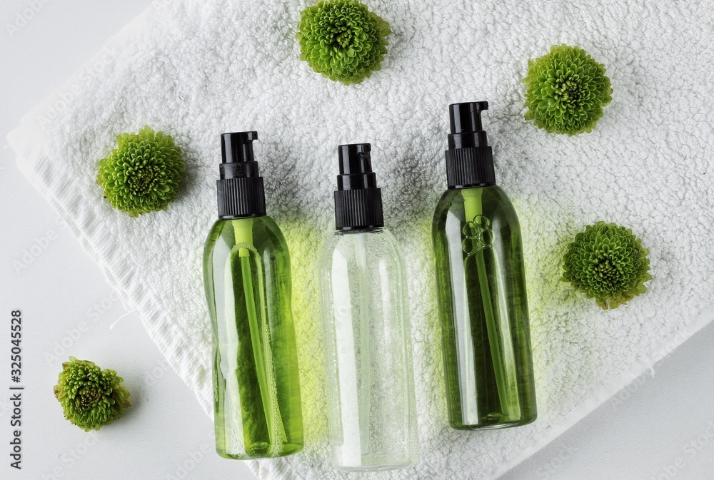 Organic skincare products on minimalistic SPA background with copy space