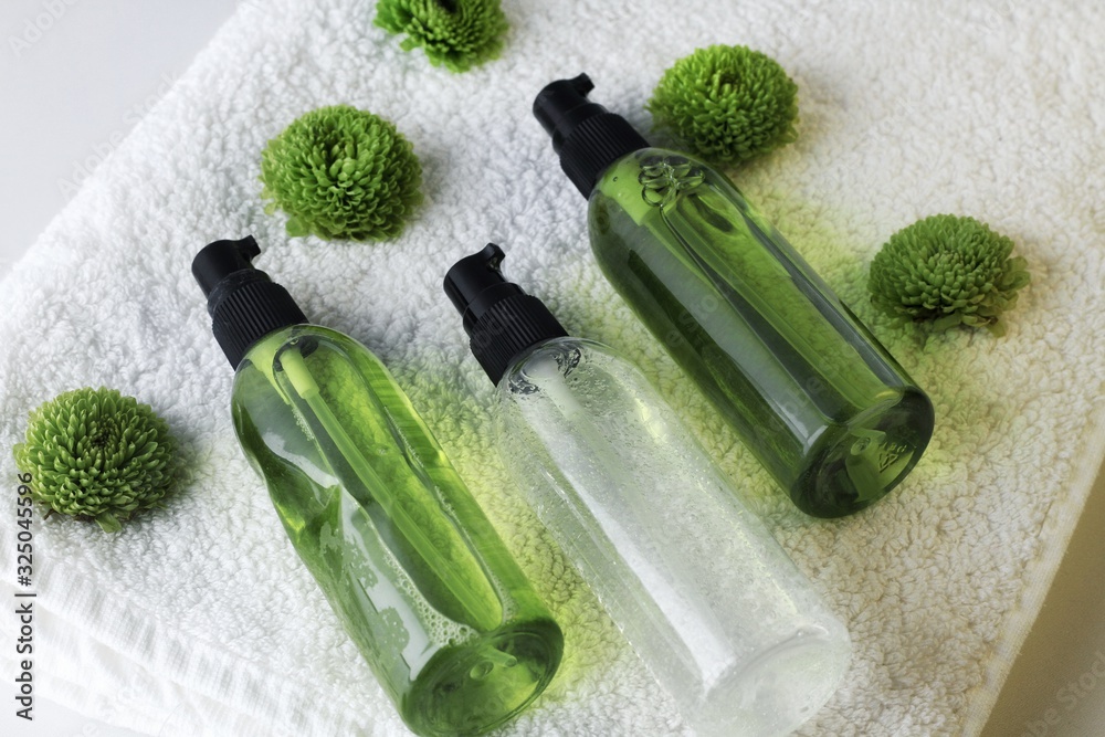 Organic skincare products on minimalistic SPA background with copy space