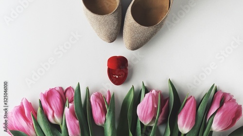 Beautiful spring flowers bouquet with cosmetics for greetings isolated on white