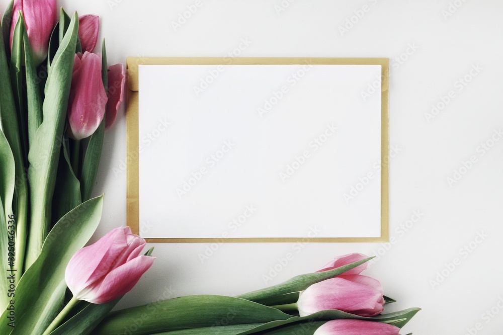 Beautiful spring flowers bouquet with cosmetics for greetings isolated on white
