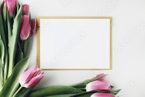 Beautiful spring flowers bouquet with cosmetics for greetings isolated on white
