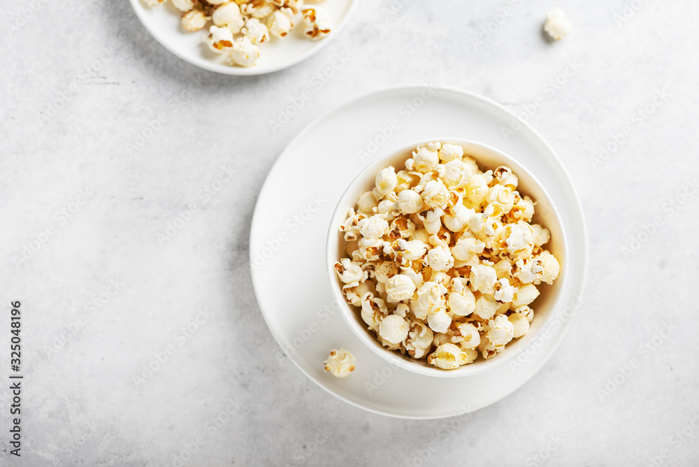 Salt popcorn in the light bowl Salt popcorn in the light bowl
