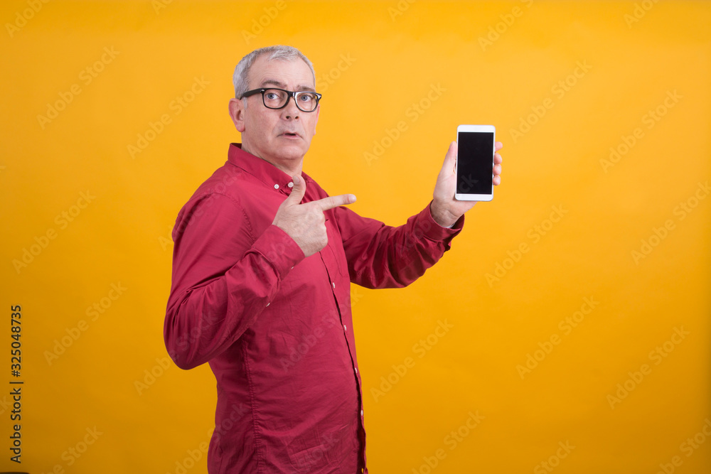 senior man showing mobile phone