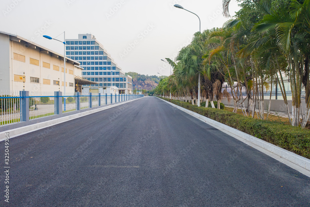 Fototapeta premium An asphalt road leads to the distance