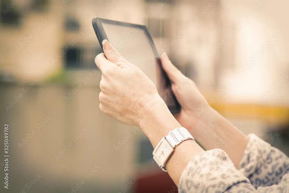 woman using a tablet or e-book