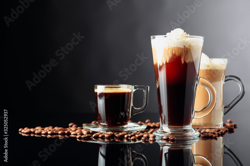 Coffee drinks and coffee beans on black background.