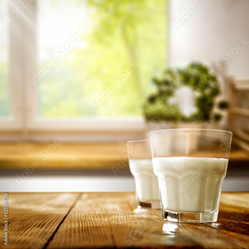 Desk of free space and fresh cold milk on table 