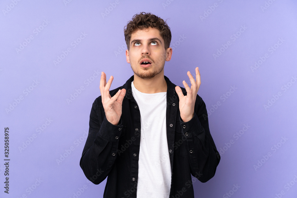 Caucasian man isolated on purple background stressed overwhelmed Caucasian man isolated on purple background stressed overwhelmed