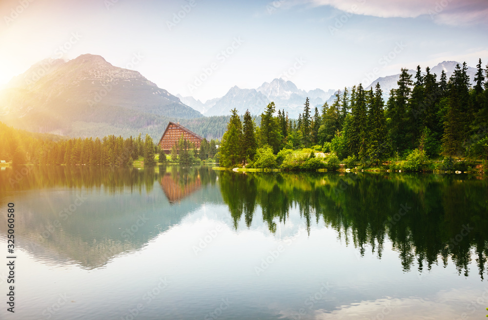 Fototapeta premium Calm mountain lake in National Park High Tatra. Location place Strbske pleso, Slovakia, Europe.
