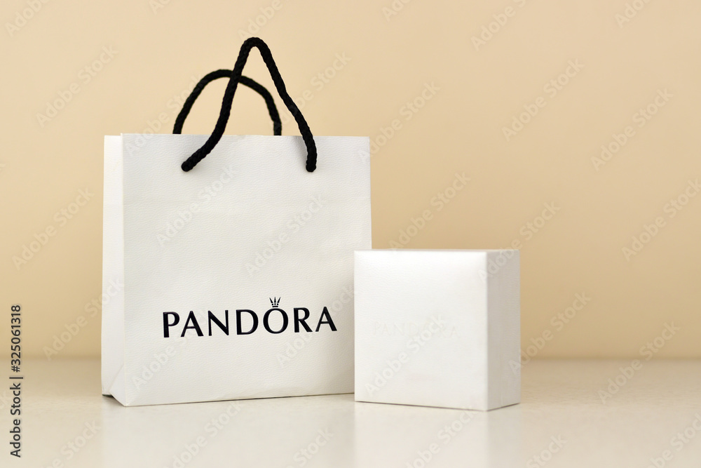 Pandora carrier paper bag with logo. Pandora brand is a manufacturer of  jewelry products in Copenhagen, Denmark Stock Photo | Adobe Stock
