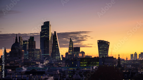 Epic dawn sunrise landscape cityscape over London city sykline looking East along River Thames photo