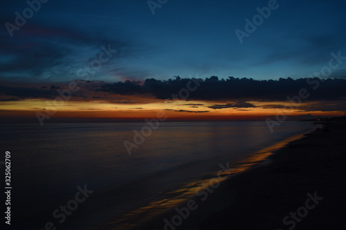 Beautiful sunset over calm sea Liepaja Latvia