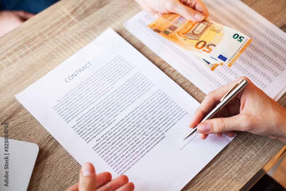 Obraz premium Human in the office receives the bribe for signing the contract.