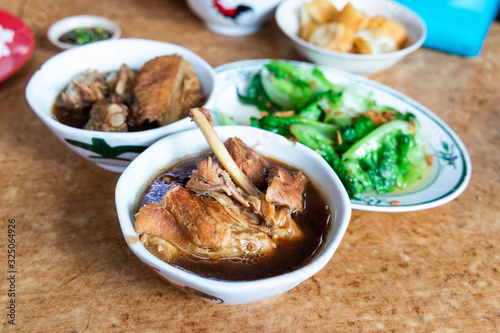 Serving of bak kut teh with vegetable, popular meal in Klang, Malaysia photo