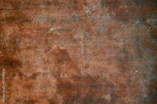 Texture of old wooden table with scratches and stains. Burgundy vintage background.