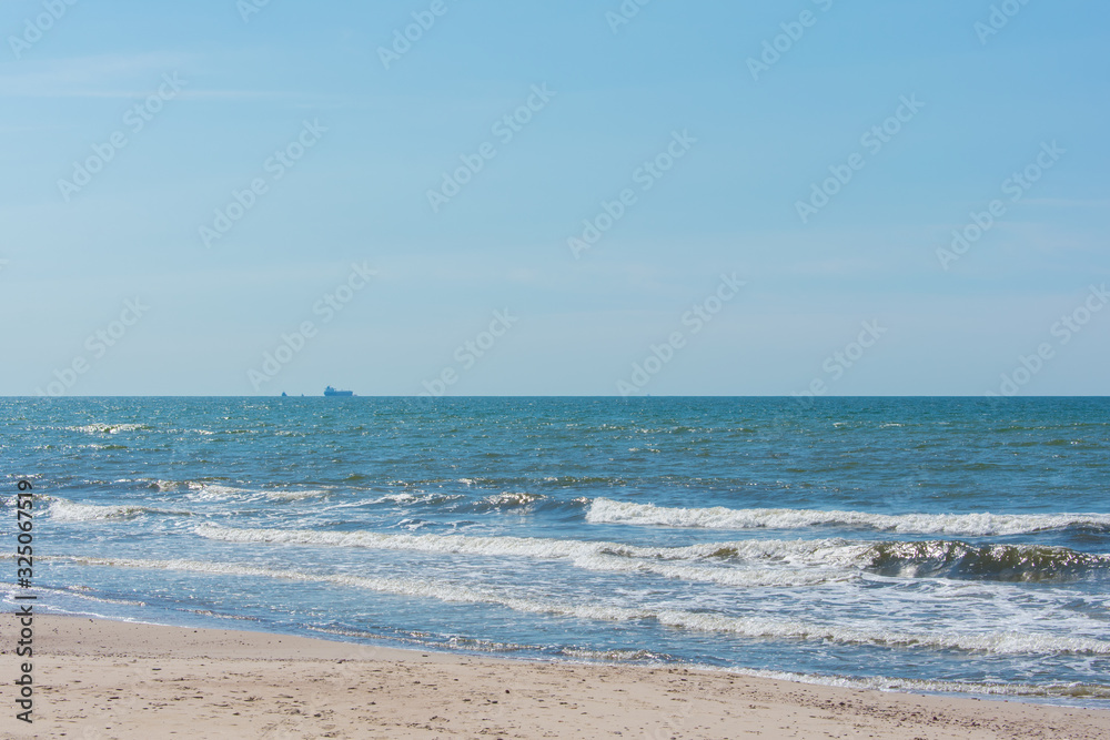 Beach landscape with steep dune coast blue sky Liepaja Skede Latvia