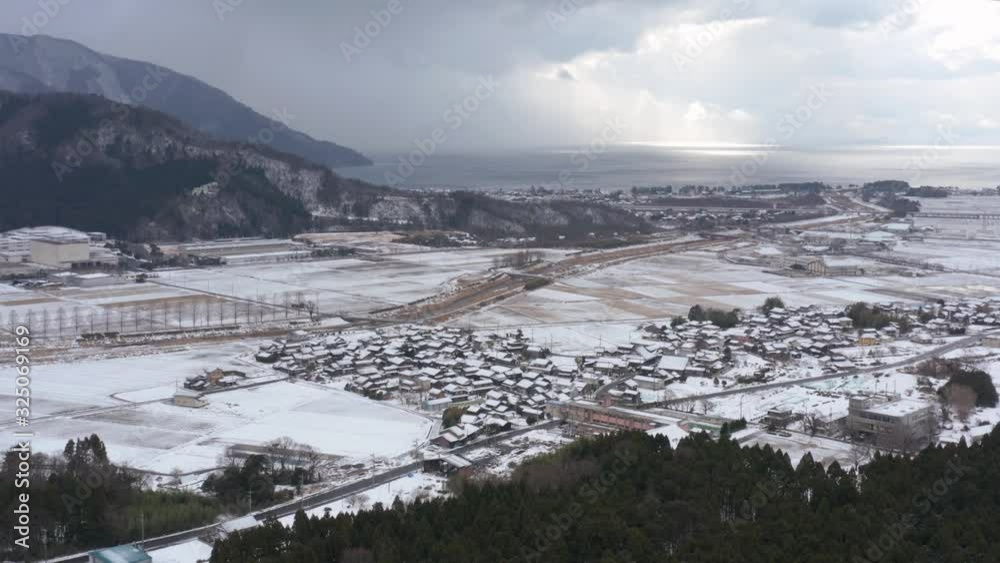 Snowy Village in Shiga, Japan. Aerial Push Towards Lake Biwako Snowy Village in Shiga, Japan. Aerial Push Towards Lake Biwako