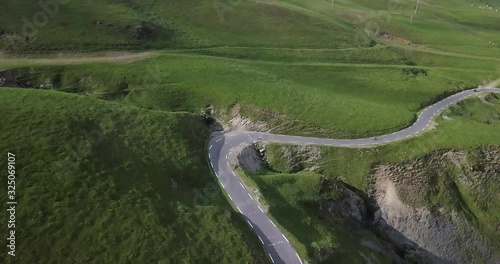 drone view of cyclistst in the mountains photo