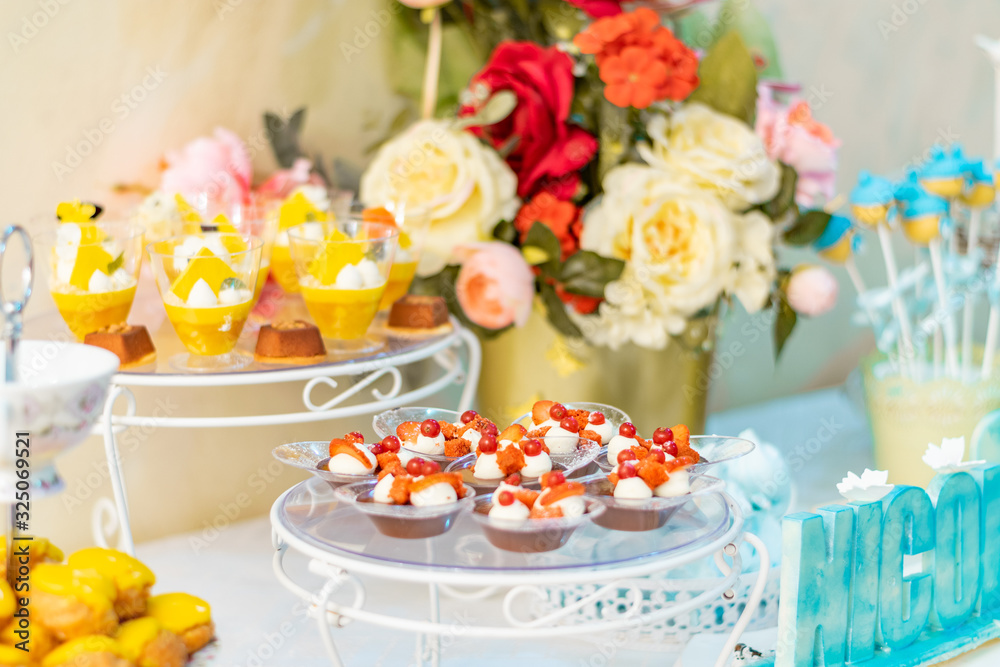 table setting with flowers and sweets