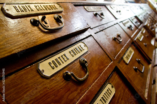 Lviv, Lviv region / Ukraine - February 01, 2020: the photo was taken on a walk in Lviv. Chest drawers in a vintage pharmacy with medicine nameplates.