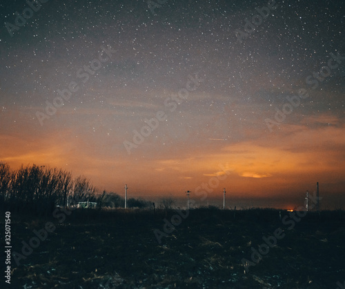 sunset in city with stars