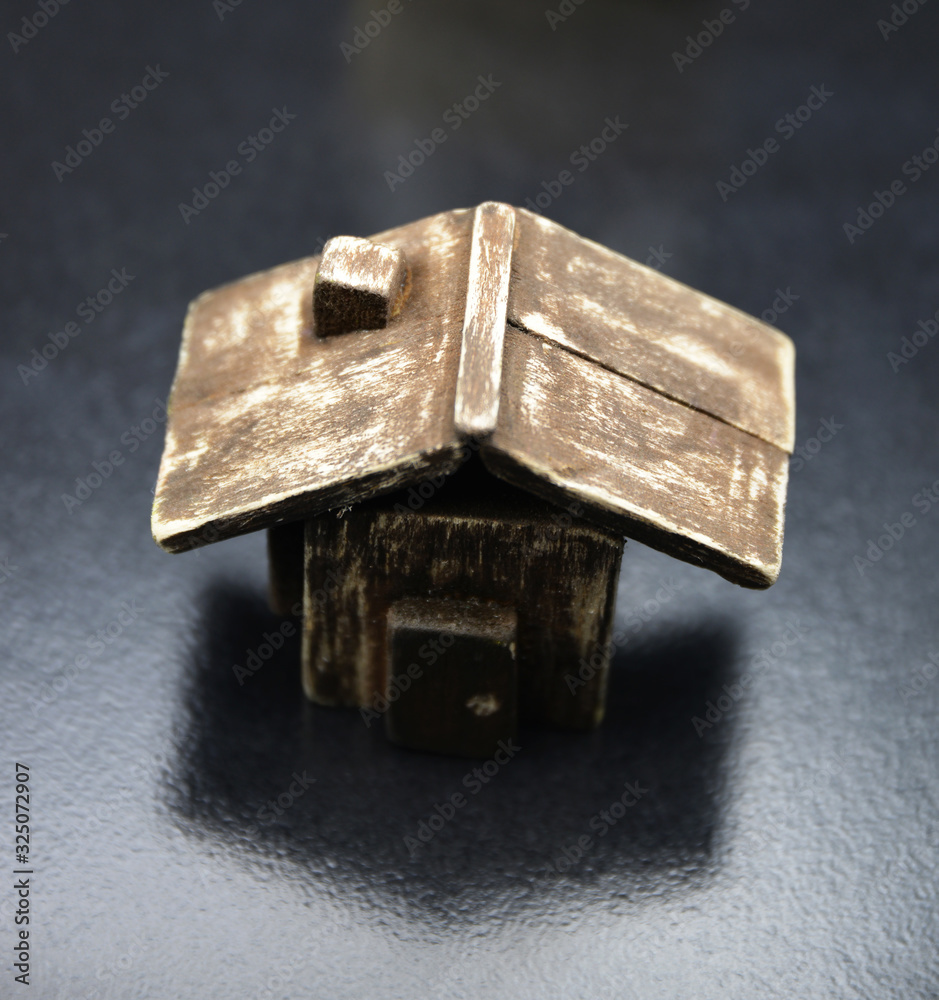 wooden house model on black background wooden house model on black background