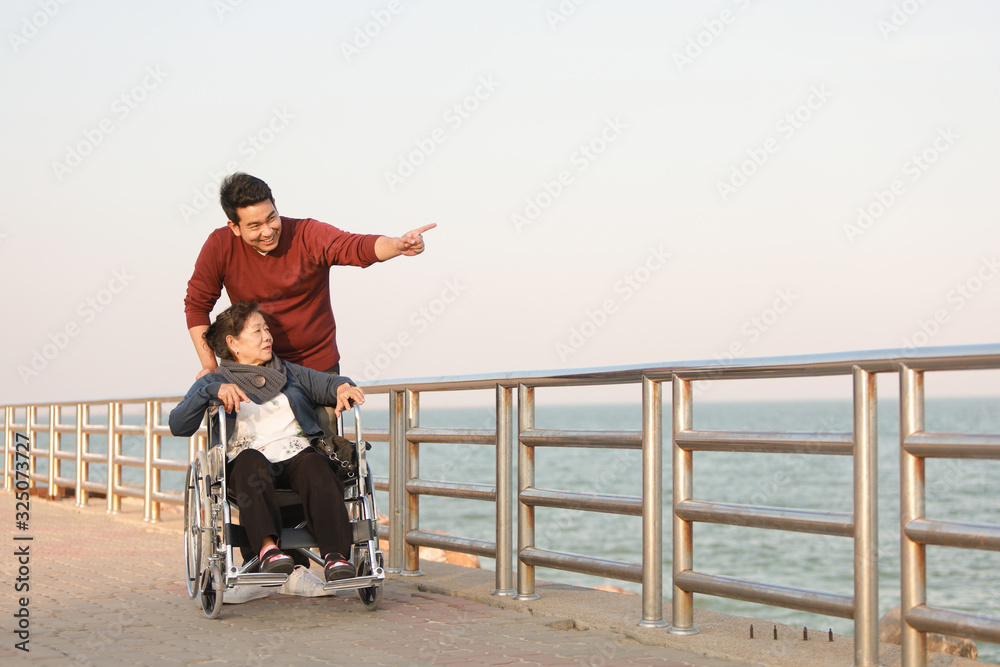 Portrait of Asian senior mother and young man son smile and happy face