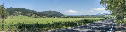 road and  green countryside landscape  near Hikuai  New Zealand