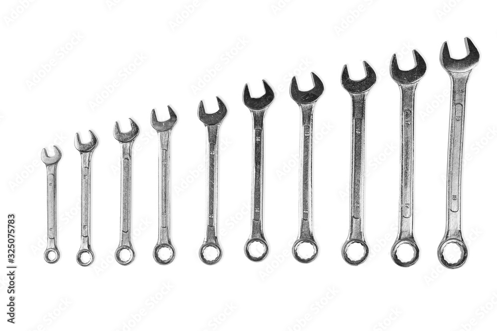 set of steel wrenches arranged in ascending order. Isolated on a white background. set of steel wrenches arranged in ascending order. Isolated on a white background.
