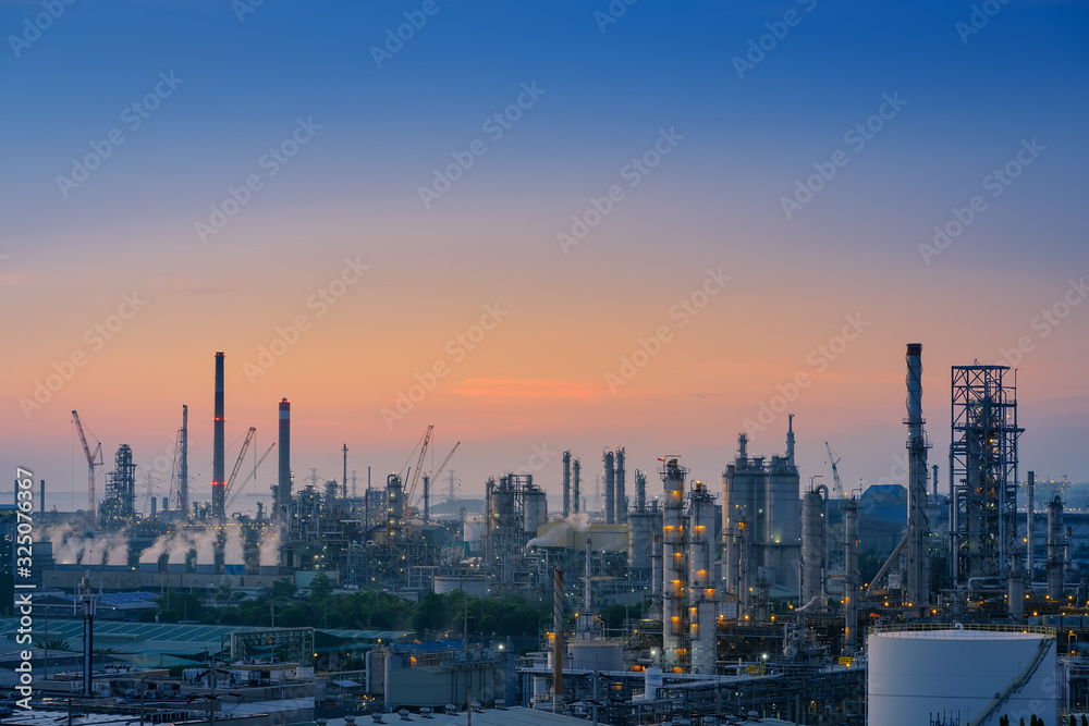 Oil and gas refinery plant or petrochemical industry on sky sunset background, Heavy equipment of Hydrocarbon industry, Manufacturing of petrochemical industrial