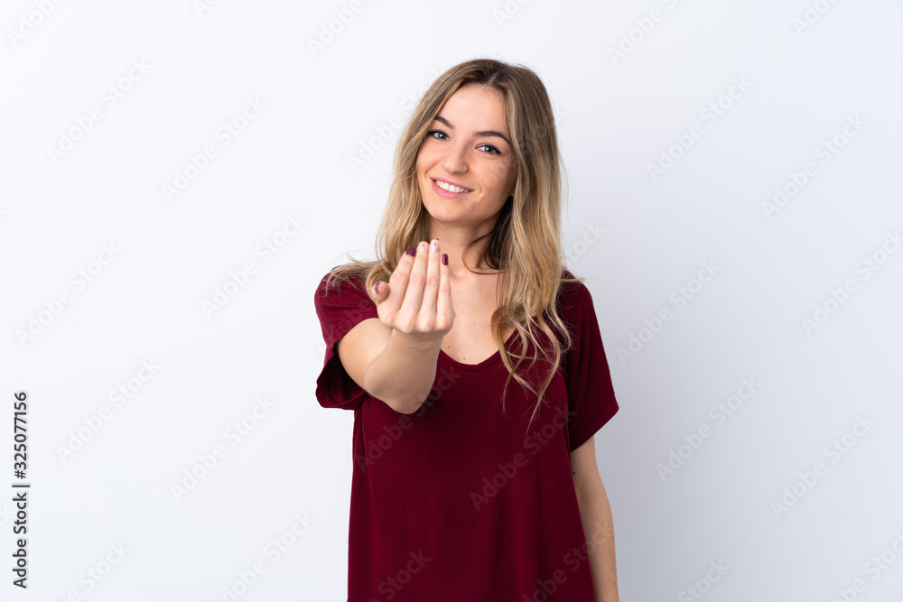 Young woman over isolated white background inviting to come with hand. Happy that you came