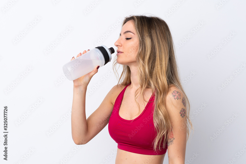Young sport woman over isolated white background with sports water bottle Young sport woman over isolated white background with sports water bottle