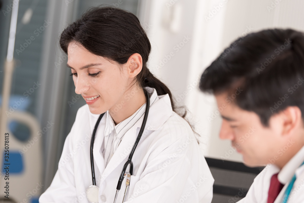Two doctors have working together with happiness in the hospital. Two doctors have working together with happiness in the hospital.