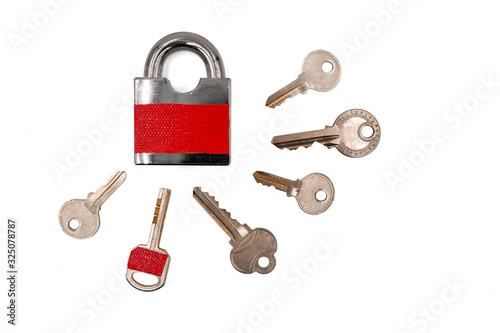 Tablou pe pânză one key with red sticker among many keys which is the same color of padlock , mi