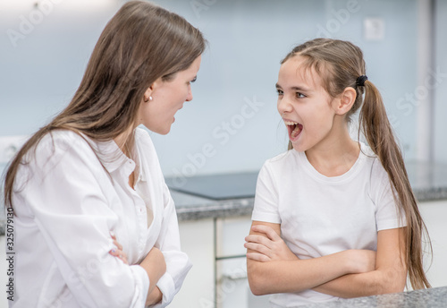 Mom and daughter shout at each other at home