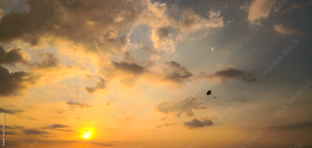 Sky Diving with Beautiful sunset. Kata beach. Phuket, Thailand.
