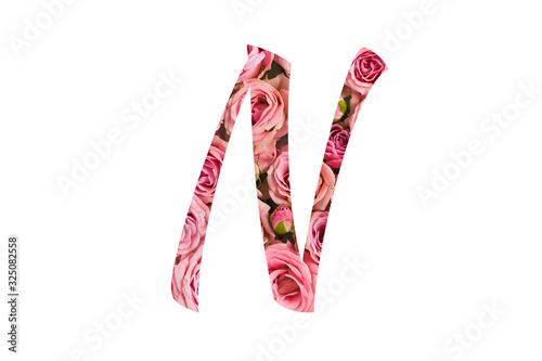 The letter N of the English alphabet is cut out of pink roses on a white isolated background.Floral pattern, texture.Bright alphabet for stores, sales, websites, postcards and holiday greetings.