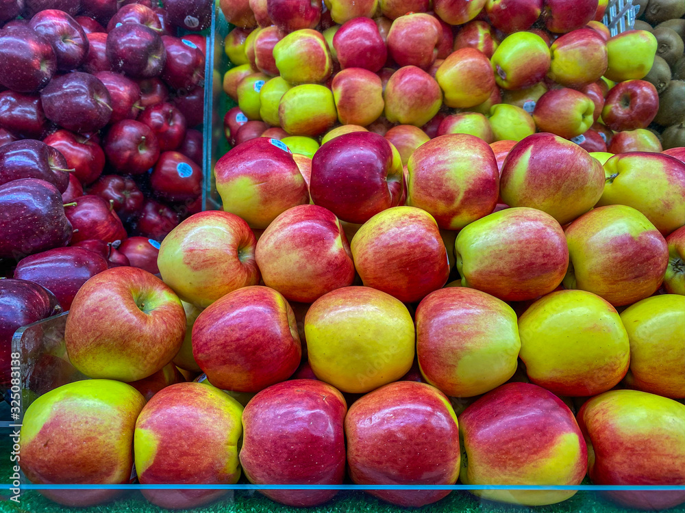 Assortment of fresh apples for sale at fruit market