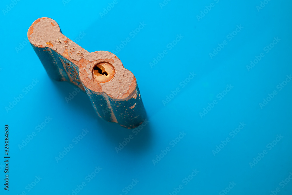 padlock closeup on blue background