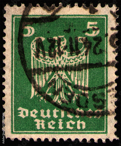 GERMANY - CIRCA 1924: postage stamp 5 German rentphening printed by Germany, shows New imperial eagle, stylized heraldic animal, circa 1924 photo