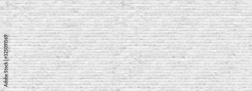 Old white brick wall background, wide panorama of masonry