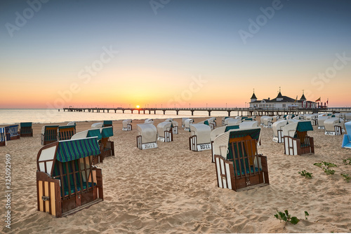 Fototapeta Naklejka Na Ścianę i Meble -  morning time at baltic sea beach and sight Ahlbeck pier in sunrise